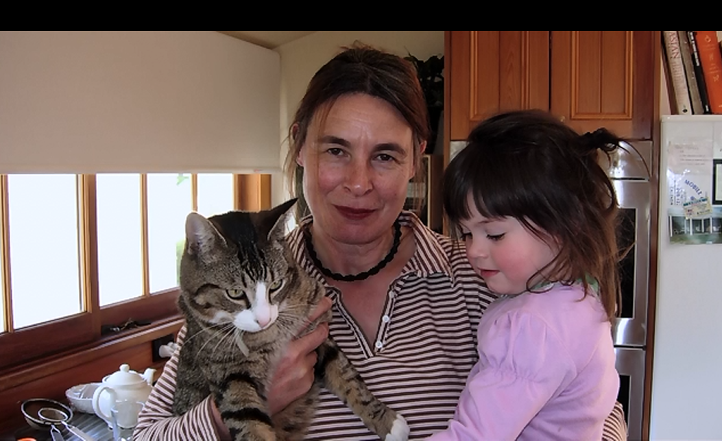 sue with cat n child.png